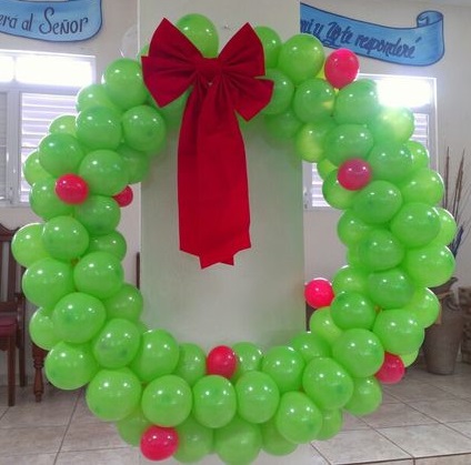 Green balloon wreath with red bow.