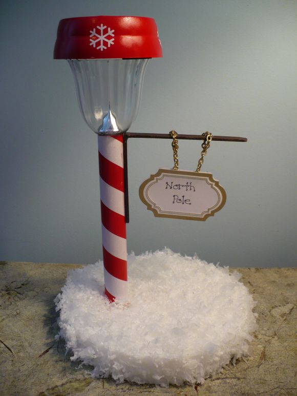 Make a North Pole Street Sign from a Dollar Store Solar Light.