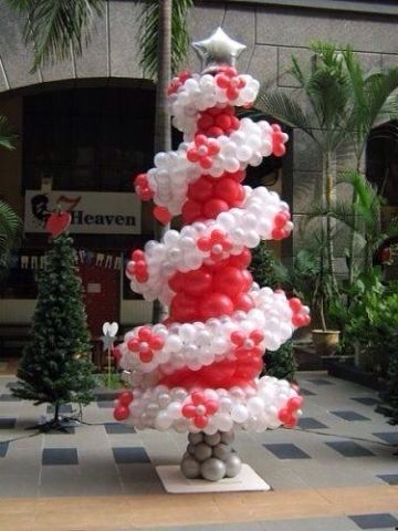 Red and white balloon Christmas tree with silver star tree topper.