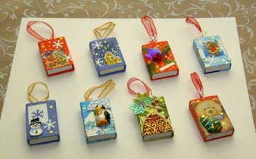 Reuse matchboxes as christmas ornament .. and you can put a surprise inside too.