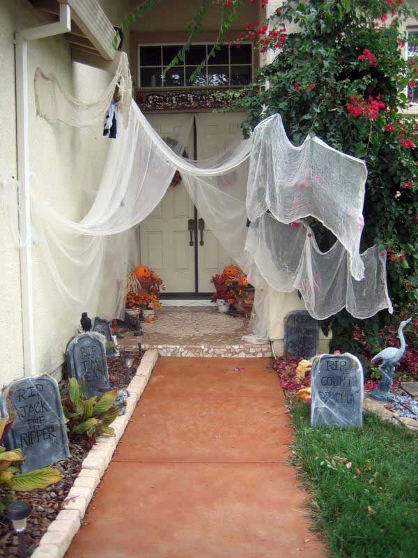 Artificial spider web and tombstones.