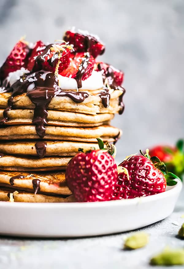 Lemon cardamom pancakes with strawberries and chocolate