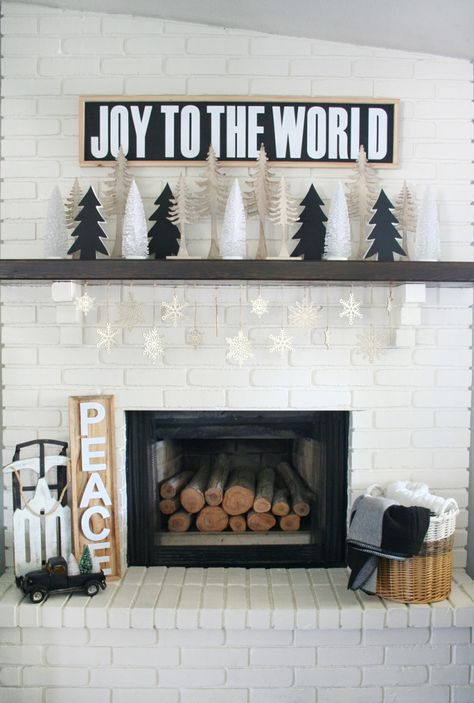 Stunning black and white Christmas mantel Via The Crafted Sparrow